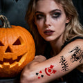 Model with clown makeup wearing joker clown temporary tattoos on arm beside a jack-o'-lantern